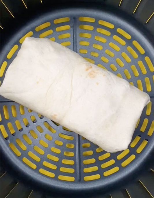 Air Fryer Breakfast Wrap place the wrap in the air fryer